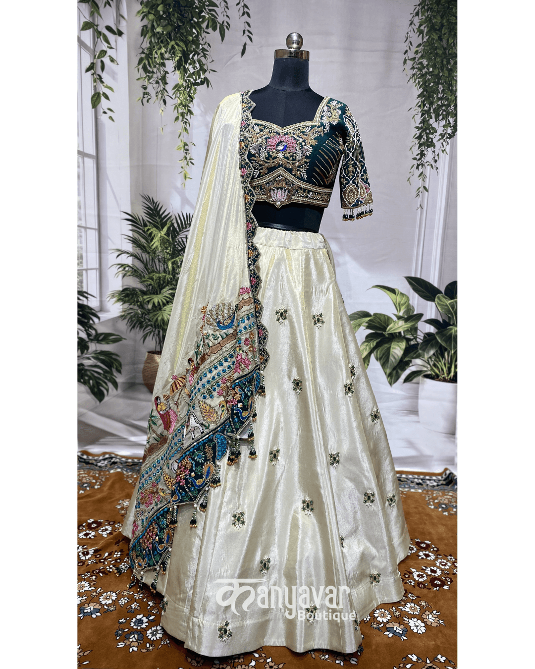 The Ivory & Bottle Green Peacock Lehenga
